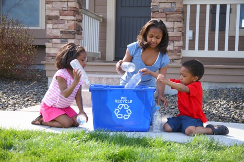 Workers managing construction debris for effective waste disposal